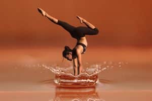 What is hypnotherapy used for? Aiding athletic performance. Woman in water performing yoga.