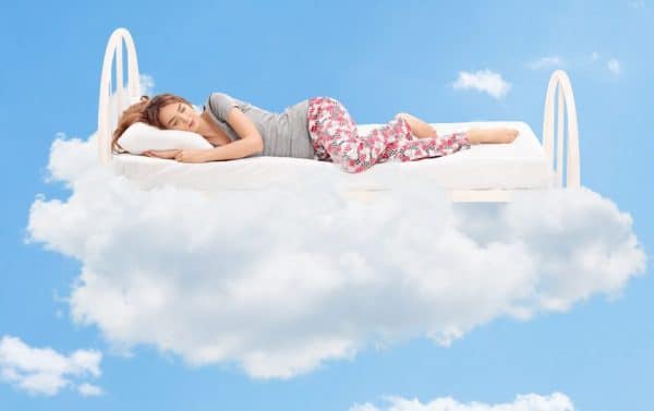 Hypnotic induction - an image of someone in hypnosis asleep on a bed of clouds relaxation rapid induction progressive hypnosis