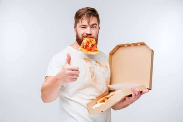 Motivational interviewing may help this chap in a dirty white t-shirt with a mouth full of pizza