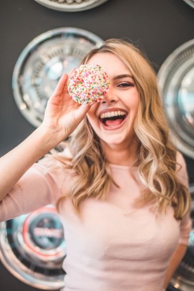 Sugar craving woman with a donut