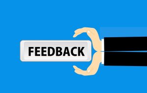 Feedback word between two hands - best hypnotherapy course blog 