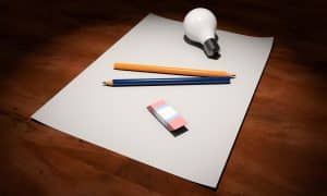 core hypnotherapy training visualing success sheet of paper, lightbulb, pencils and eraser 