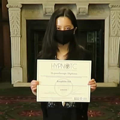 Hypnotherapy graduate, holding the hypnotherapy diploma certificate.