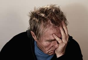 work-life balance signs of burnout - picture of man in burnout