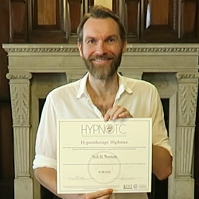 Hypnotherapy graduate, holding the hypnotherapy diploma certificate.