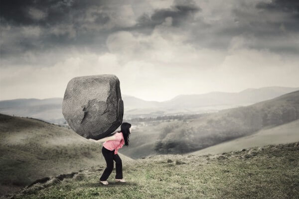overwhelmed too much cope stress anxiety overwhelming rock mountain boulder woman