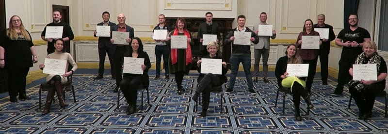 Hypnotherapy students and their diploma certificates, having passed the HypnoTC diploma course
