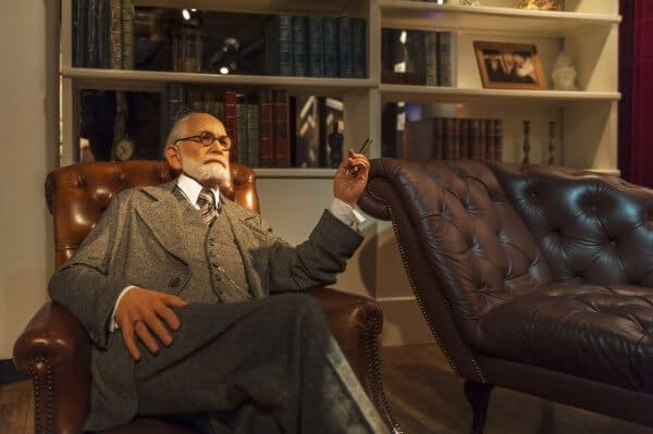 Elderly man in a suit sitting in a leather chair. Boundaries.