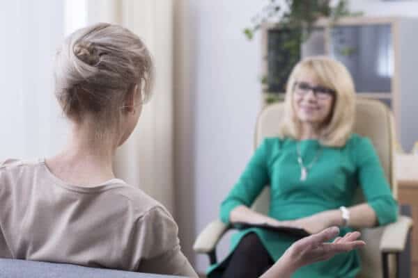 Therapist actively listening to her client